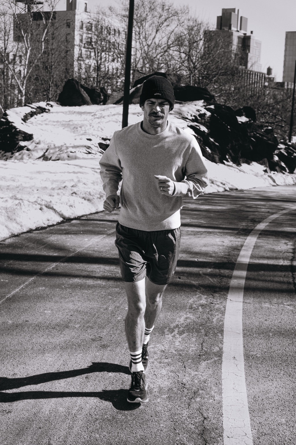 Runner approaching the camera on a winter path